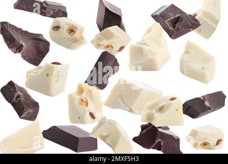 Delicious chocolate chunks falling on white background Stock Photo