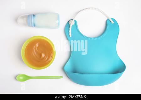 https://l450v.alamy.com/450v/2mxf5nk/flat-lay-composition-with-baby-food-and-accessories-on-white-background-2mxf5nk.jpg
