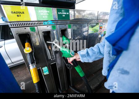 Sp95 Gas Illustration picture shows a person using a petrol pump (unleaded fuel ...