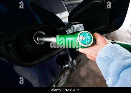 Sp95 Gas Illustration picture shows a person using a petrol pump (unleaded fuel ...