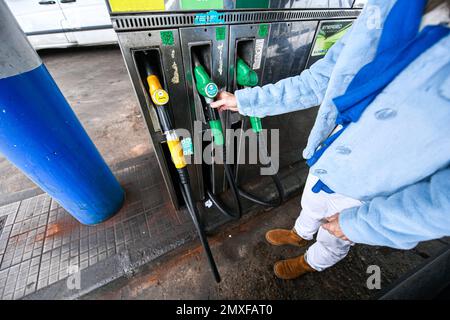 Sp95 Gas Illustration picture shows a person using a petrol pump (unleaded fuel ...
