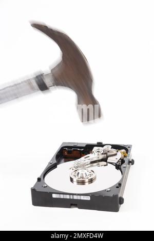 Destroying a hard drive with a hammer Stock Photo