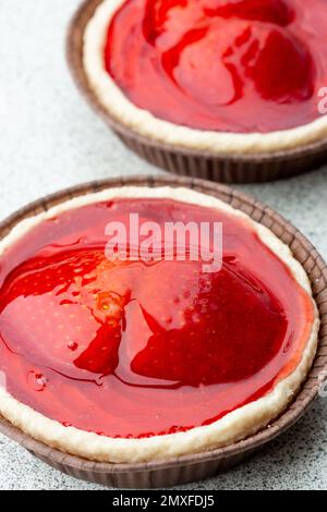 A close up of two bright red strawberry tarts Stock Photo