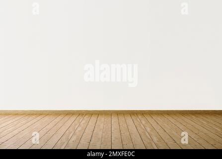 Wooden floor with painted white wall. Empty room background. Stock Photo