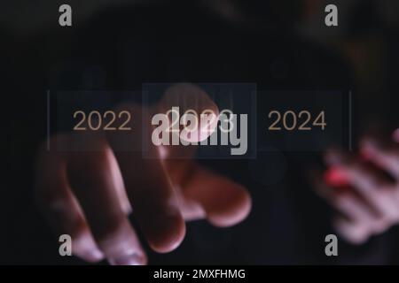 Touching on virtual screen loading bar for 2023 New Year, Start new year 2023 Stock Photo