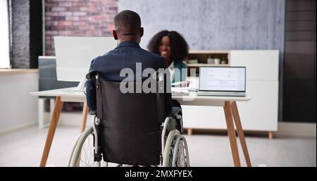 Employee Disability After Injury. Man In Wheel Chair Stock Photo