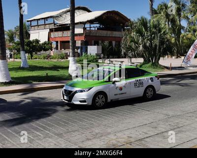 Puerto Escondido Oaxaca Mexico 26. January 2023 Colorful green taxi cab car in Puerto Escondido Zicatela Oaxaca Mexico. Stock Photo