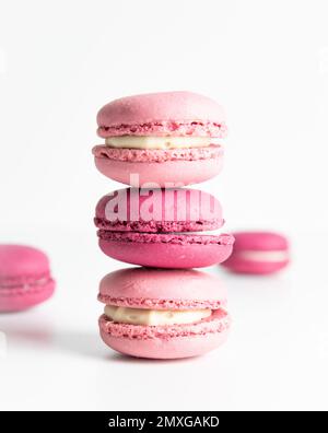 Stack of pink macaroons on white background Stock Photo