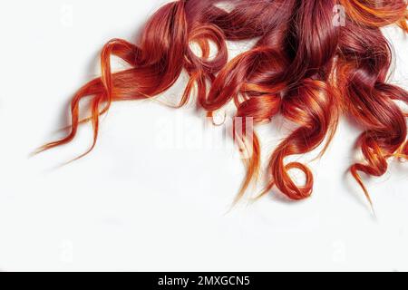 dark red curly hair on isolated white background Stock Photo