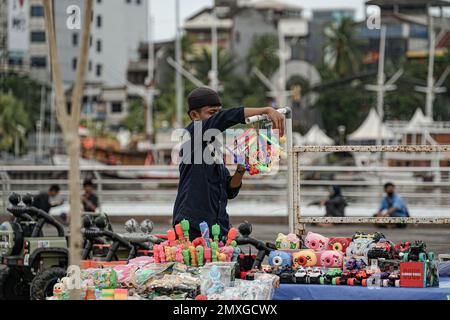 Makassar, South Sulawesi, Indonesia. 3rd Feb, 2023. Toy traders in the Losari Beach area, Makassar City, are checking their merchandise. (Credit Image: © Herwin Bahar/ZUMA Press Wire) EDITORIAL USAGE ONLY! Not for Commercial USAGE! Credit: ZUMA Press, Inc./Alamy Live News Stock Photo