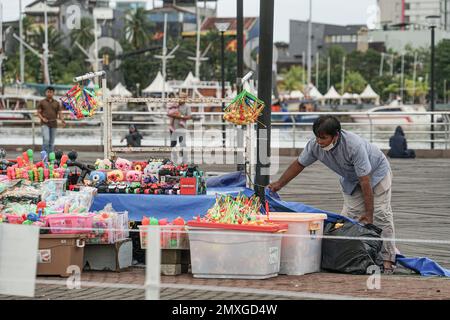 Makassar, South Sulawesi, Indonesia. 3rd Feb, 2023. Toy traders in the Losari Beach area, Makassar City, are checking their merchandise. (Credit Image: © Herwin Bahar/ZUMA Press Wire) EDITORIAL USAGE ONLY! Not for Commercial USAGE! Credit: ZUMA Press, Inc./Alamy Live News Stock Photo
