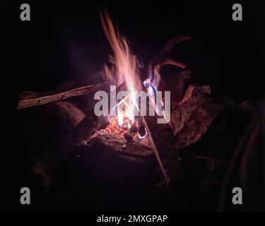 Bonfire flame with sparks in complete darkness at night Stock Photo - Alamy