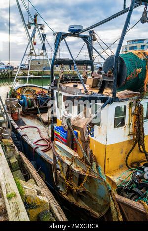 UK fishing industry - trawler in dock at West Bay, Dorset. Stock Photo