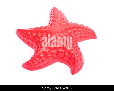 Red plastic starfish isolated on white background Stock Photo