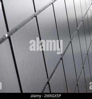 Metal wall with abstract square shape design, selective focus Stock Photo