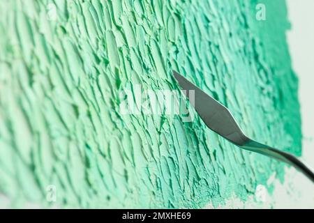 Abstract colorful artwork painting with spatula, closeup view Stock Photo