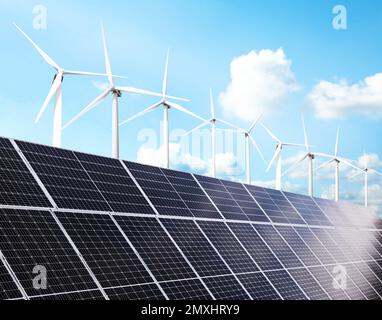 Solar panels and wind turbines installed outdoors. Alternative energy ...