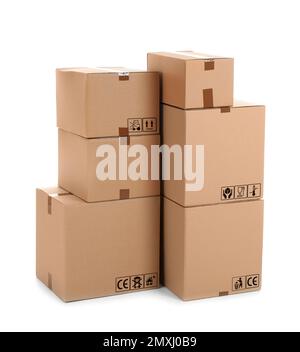 Parcel delivery. Cardboard boxes with different packaging symbols on white background Stock Photo