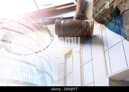Law protection. Multiple exposure of judge's gavel, scale and buildings Stock Photo