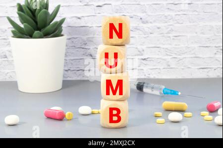 NUMB word made with building blocks isolated on white. Stock Photo