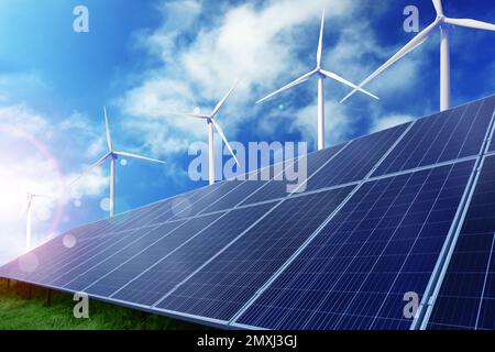 Solar panels and wind turbines installed outdoors. Alternative energy source Stock Photo