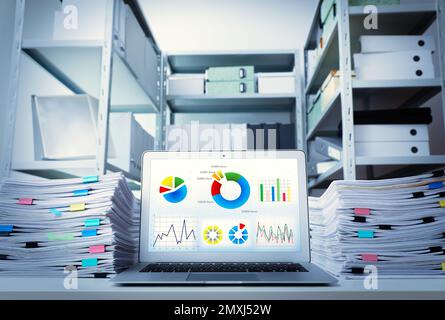 Modern laptop and documents on desk in office. Business analytics Stock Photo