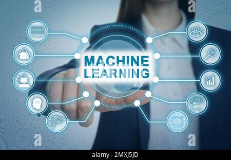 Woman touching icon on virtual screen, closeup. Machine learning concept Stock Photo