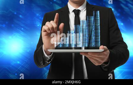 Double exposure of businessman with tablet, coins and circuit board, closeup Stock Photo