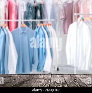 Rack of clean clothes hanging on hangers at dry-cleaning Stock Photo - Alamy