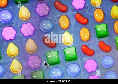 A detail from the online game Candy Crush Saga is shown on a