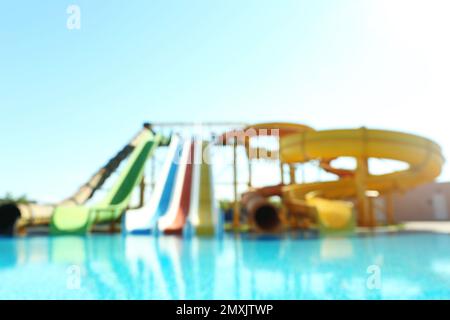 Different colorful slides in water park, blurred view Stock Photo