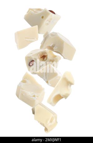 Delicious chocolate chunks falling on white background Stock Photo