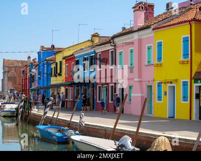 Tourists by Burano colorful houses Stock Photo