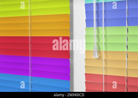 Closed multicolor window blinds as background, closeup view Stock Photo