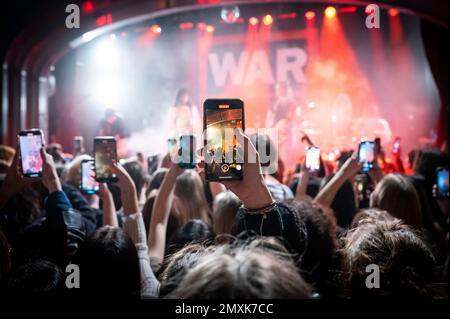 London, UK, Friday, 3rd February 2023 Mobile phones held up above the audience filming Beabadoobee (Beatrice Kristi Ilejay Laus) on stage as part of the War Child, Brit Awards week gigs at Lafayette, Kings Cross. Credit: DavidJensen / Empics Entertainment / Alamy Live News Stock Photo