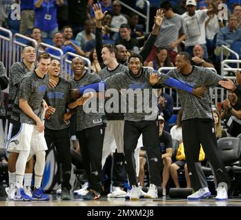 Orlando Magic players Hedo Turkoglu (15), Dwight Howard (12) and Rashard  Lewis celebrate during a 91-78 win against the Philadelphia 76ers in Game 5  of the NBA playoffs at Amway Arena in