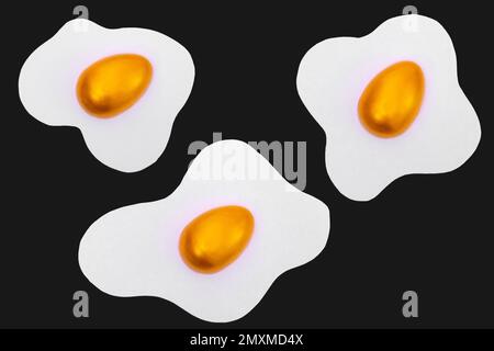 Creative layout made of scrambled eggs with decorated golden Easter eggs on a blue background. Minimal blue pattern background. Spring holidays concep Stock Photo