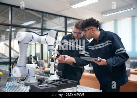Engineers Maintenance Robot Arm at Lab in a High Tech Research ...