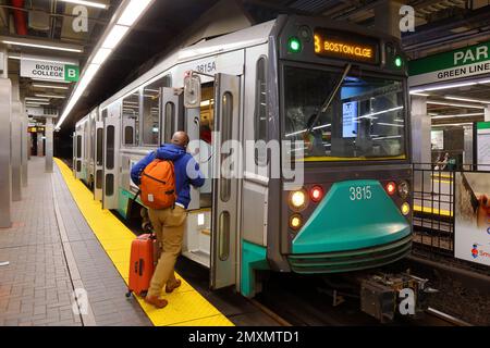 A person boarding an outbound MBTA Green Line B trolley at Park Street in Boston, Massachusetts. Stock Photo