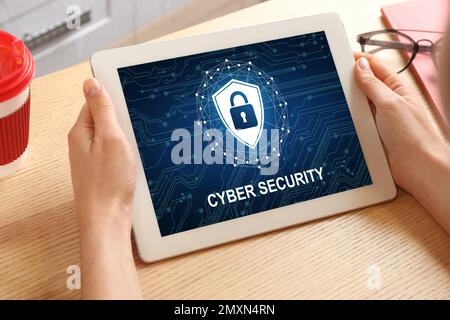 Cyber security concept. Woman using application on tablet, closeup Stock Photo