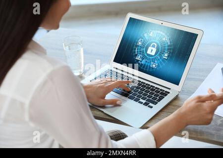 Cyber security concept. Woman using application on laptop, closeup Stock Photo