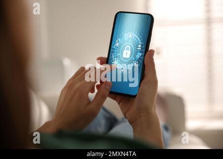 Cyber security concept. Woman using application on phone, closeup Stock Photo