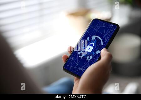 Cyber security concept. Man using application on phone, closeup Stock Photo