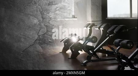 Collage of equipment in modern gym and grunge surface. Banner design with space for text Stock Photo