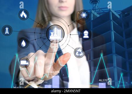 Multiple exposure of female engineer, scheme and unfinished building, closeup Stock Photo