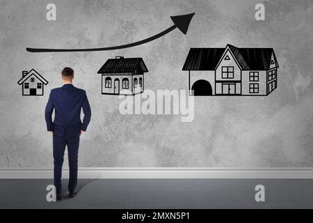 Real estate agent demonstrating prices at housing market. Man looking on graph illustration Stock Photo