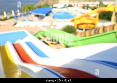 Blurred view from colorful slides in water park Stock Photo