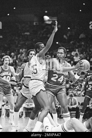 Dallas Mavericks Mark Aguirre (24) picks his way though Golden State  Warriors Mickey Johnson's feet after Aguirre came up with a rebound in  first half play at Reunion Arena in Dallas Saturday