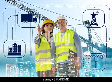 Multiple exposure of engineers, scheme, construction crane and cityscape Stock Photo