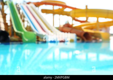 Different colorful slides in water park, blurred view Stock Photo